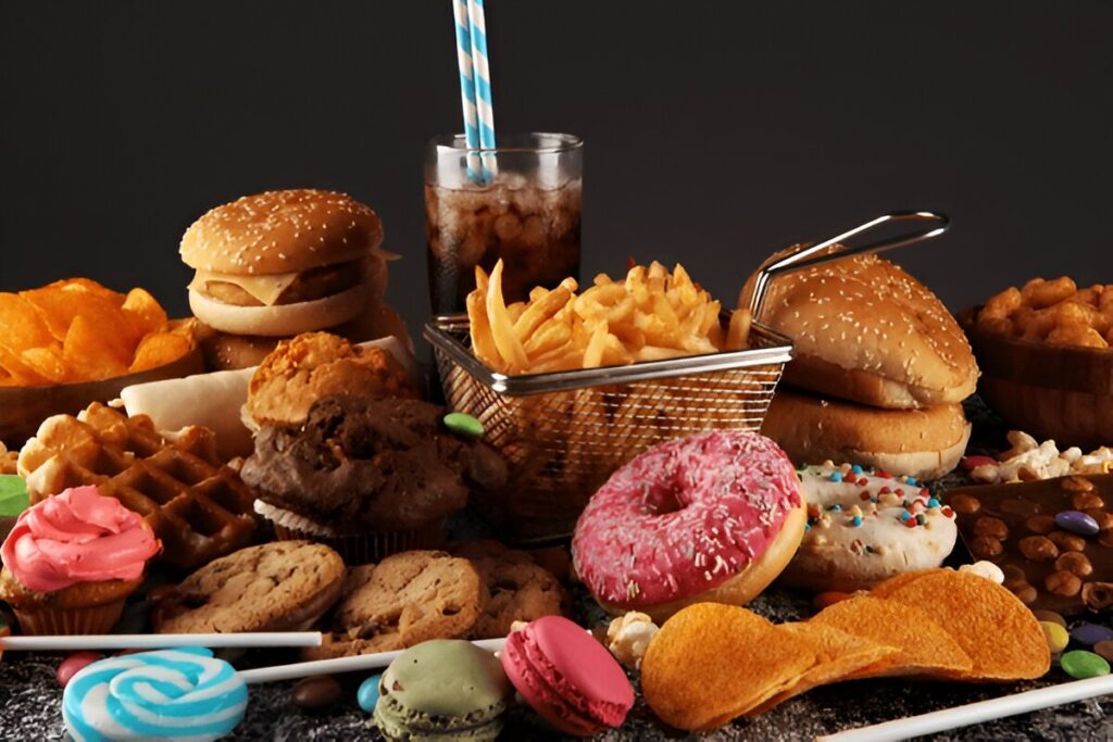 Unhealthy products. food bad for figure, skin, heart and teeth. Assortment of fast carbohydrates food with fries and cola